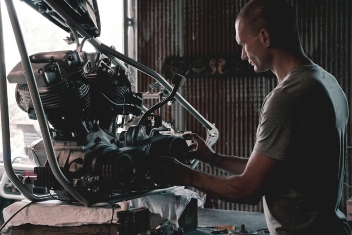 A well-organized workspace with motorcycle maintenance tools and parts laid out, showcasing a hands-on approach to DIY motorcycle care.