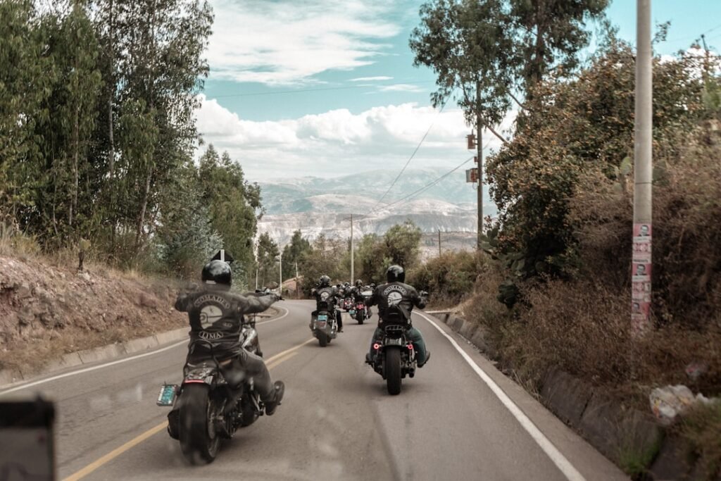 A motorcycle equipped with a dash camera mounted on the handlebars, capturing the road ahead.
