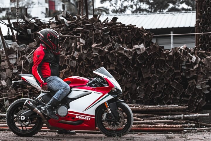A motorcyclist wearing heated gear in a cold weather setting, showcasing the gear's functionality and comfort.