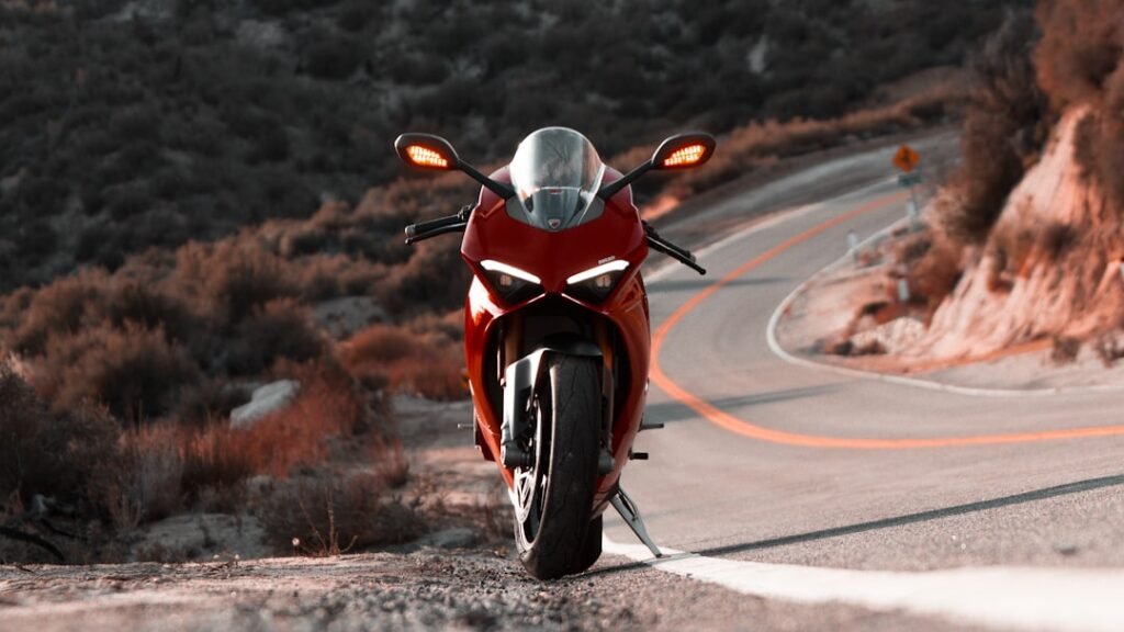 A motorcyclist practicing braking techniques on a scenic road, showcasing focus and control.