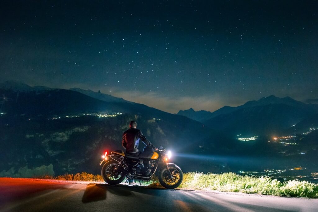 A motorcycle equipped with a dash camera mounted on the handlebars, capturing the road ahead.